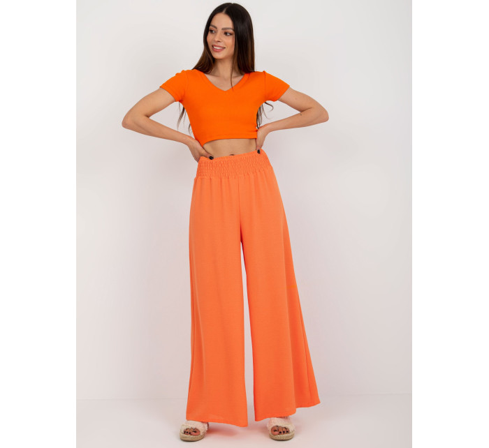 Svetlo oranžové švédske nohavice s vysokým pásom